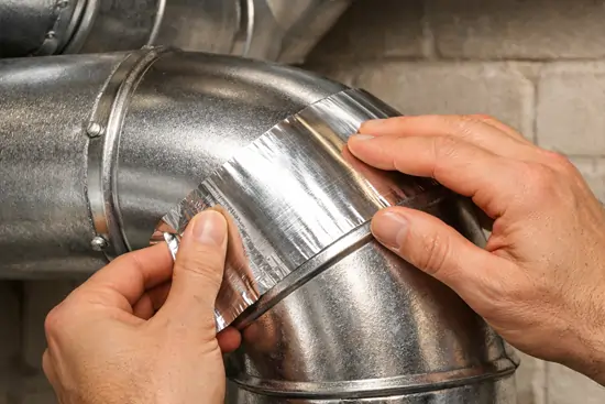 technician sealing air ducts
